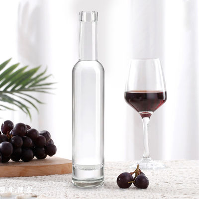 Bottiglia di liquore di vetro rotonda da 200 ml 375 ml 500 ml 750 ml 1000 ml con coperchio di sughero e disegno personalizzato