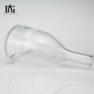 Bottiglia di vetro trasparente da 650 ml con coperchio fornito liberamente e sigillo rotondo appiattito