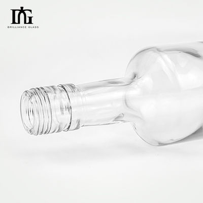 Bottiglia di 750 ml di vetro vuota, chiara e rotonda per vodka, liquori, tequila e mezcal